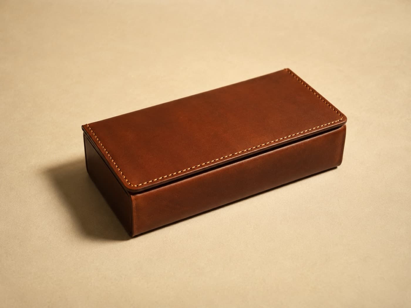 Cable Box Cover, Universal — A leather sleeve that goes over the box you already own. It is a cover, and nothing more.